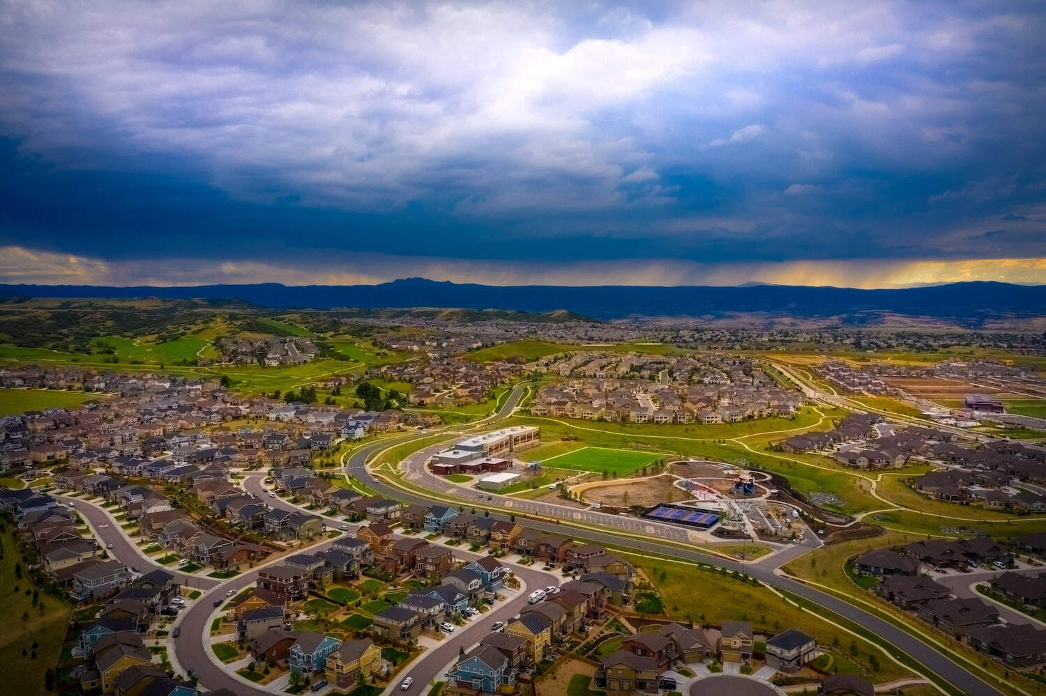 A stormy afternoon sky in Castle Rock, Colorado over suburban neighborhood castle rock roofing company