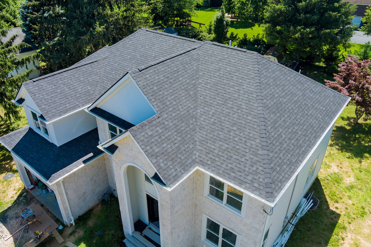 how long does it take to replace a roof overhead shot of large suburban home roofing system
