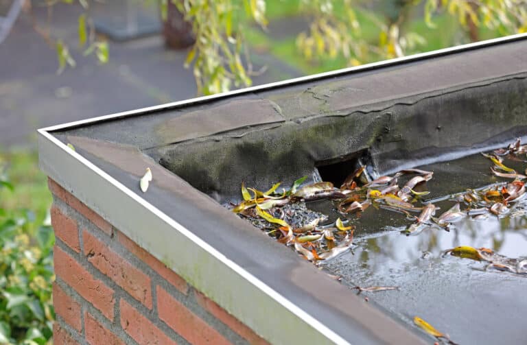 how to slope a flat roof for drainage side drain