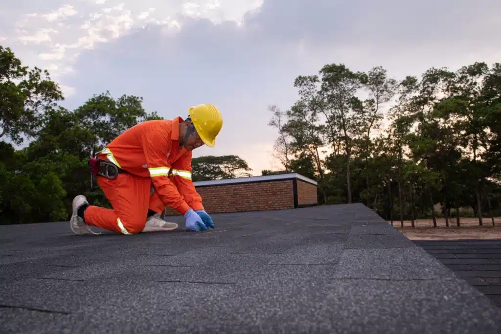 commercial roofing contractor inspects and performs roof maintenance