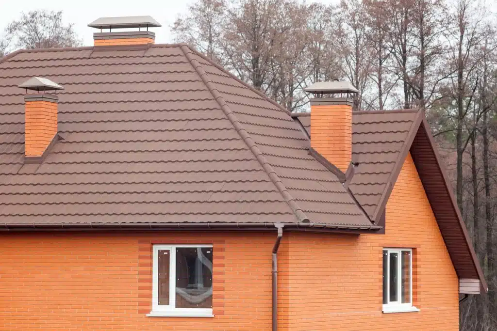 brick residential house with a Powder Coated Steel Roof