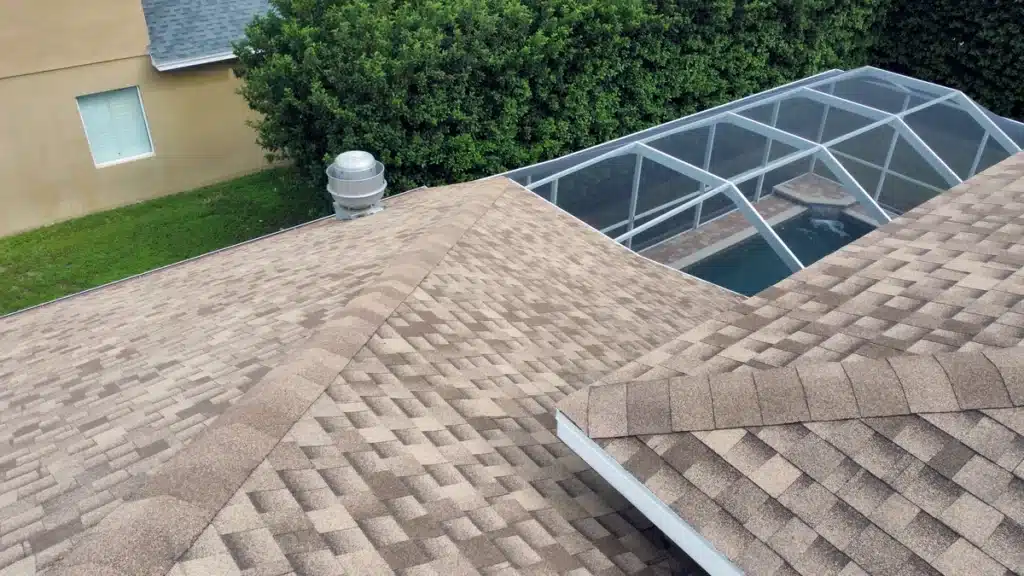 asphalt shingle roof connected to the pool screen
