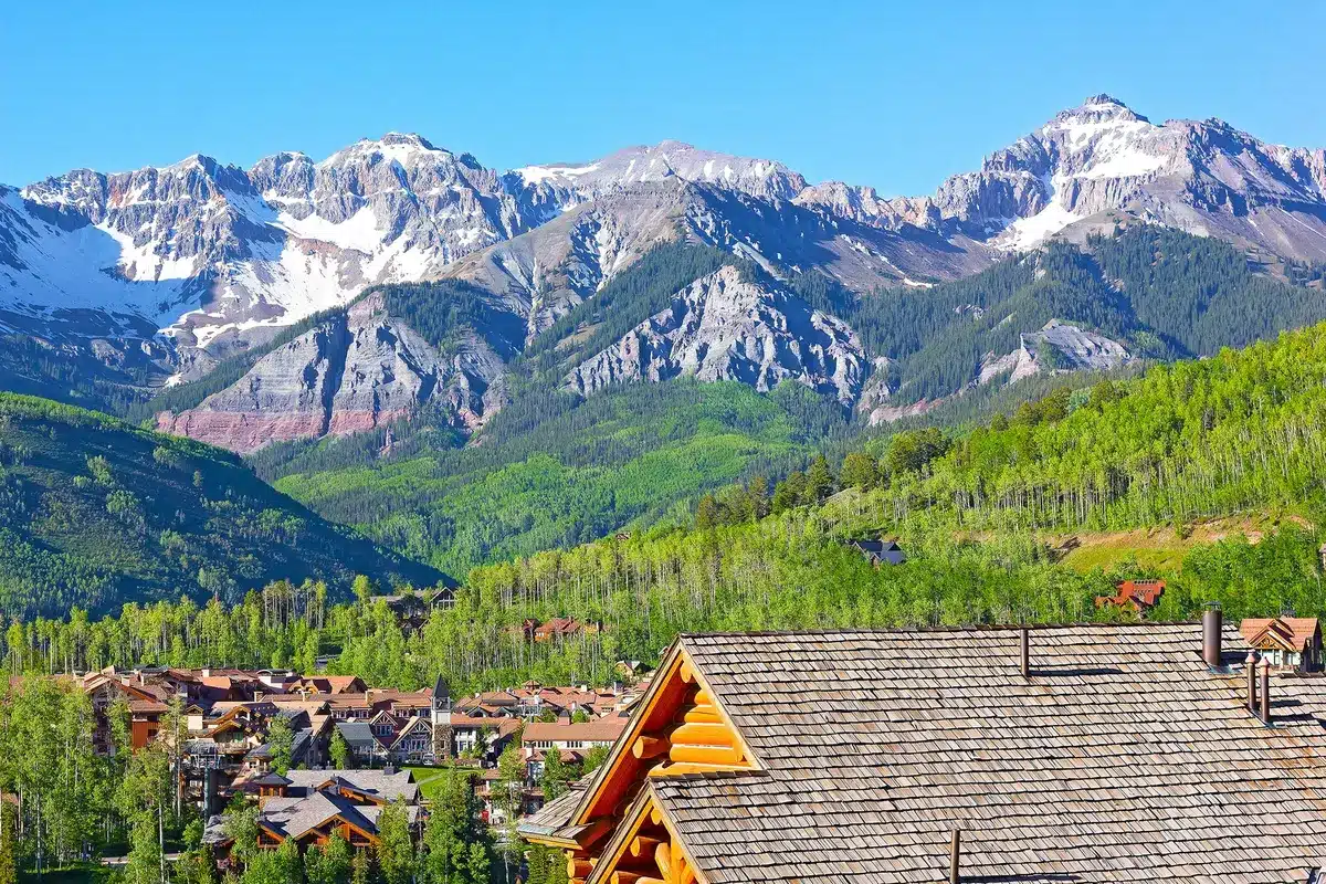 colorado springs mountains with neighborhood rooftops