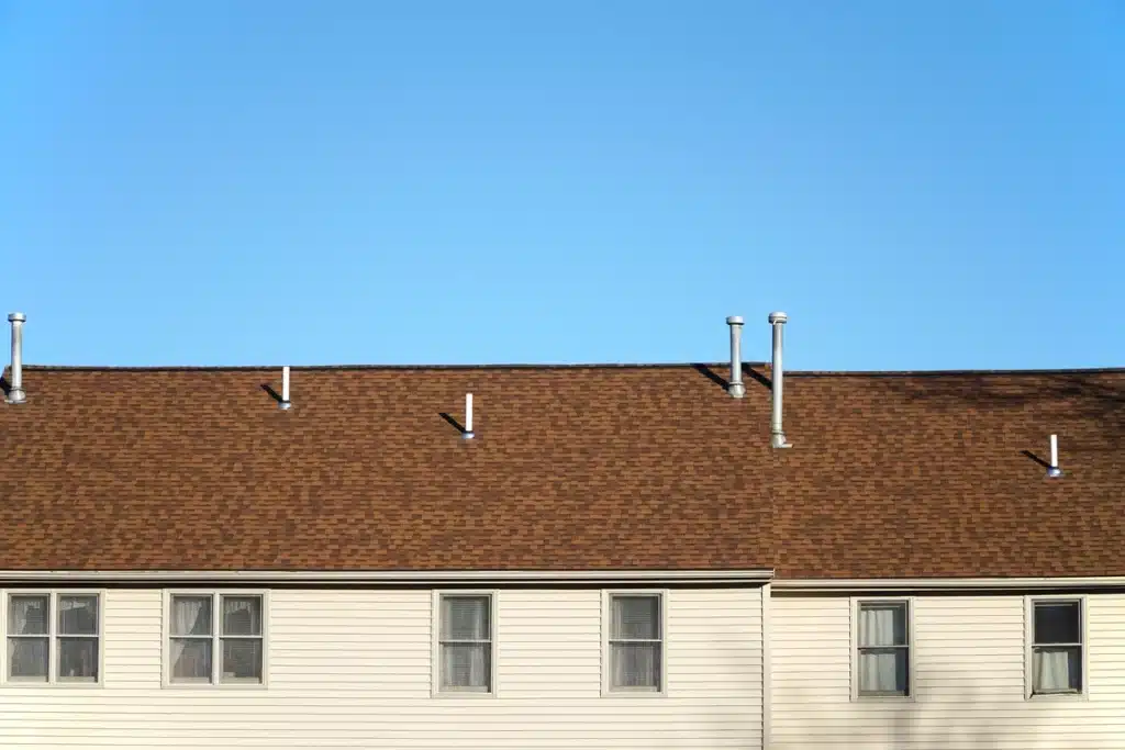 apartment building with vinyl siding close up image of roof