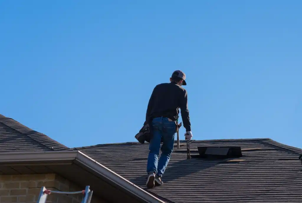Homeowner goes on roof and calculates roof pitch