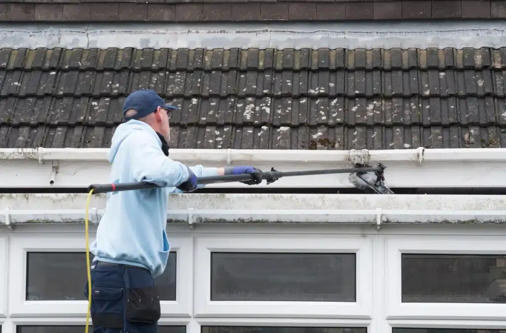cleaning a mossy roof