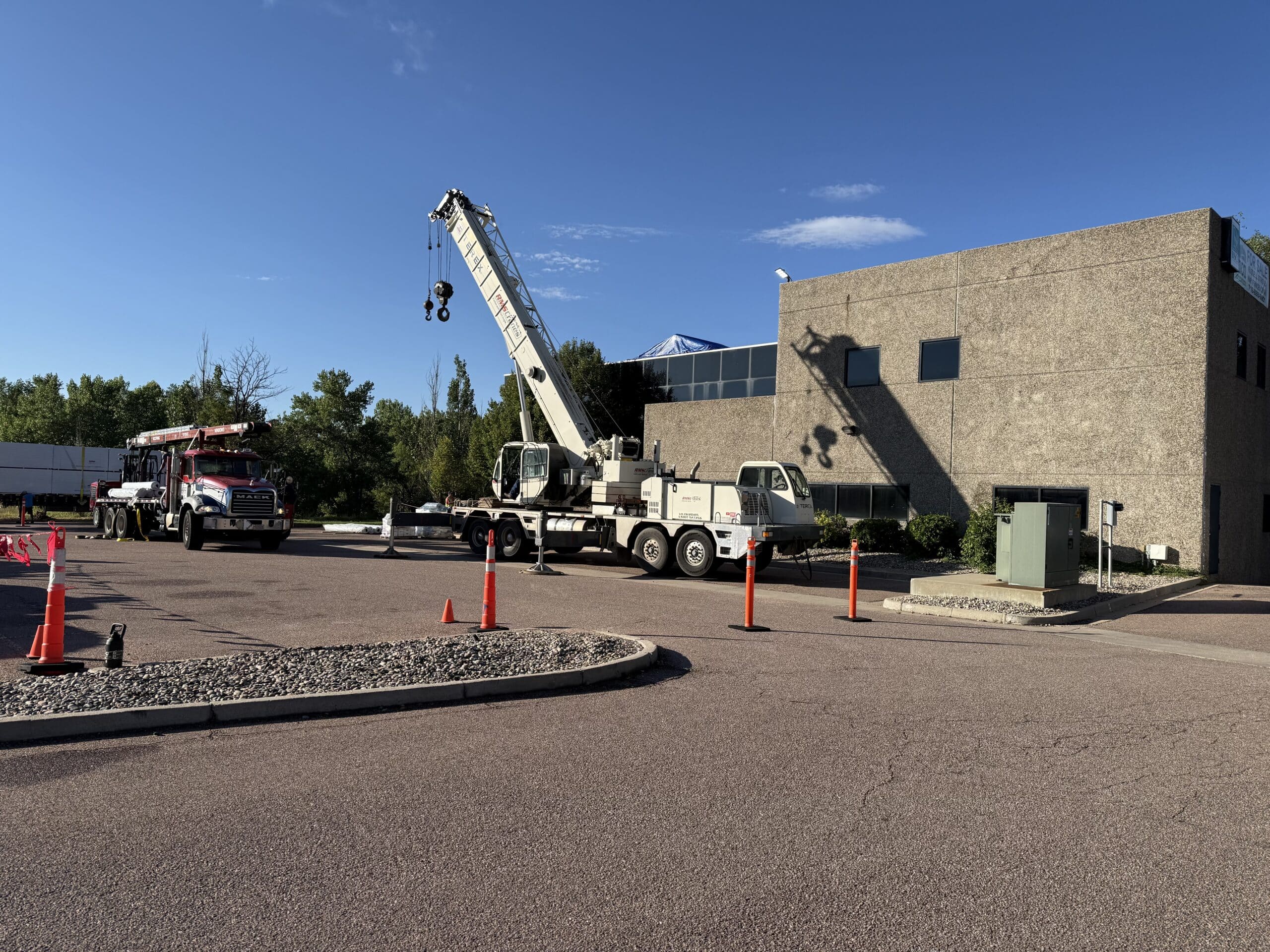 Crane supporting a Tectum Roofing commercial project in Colorado
