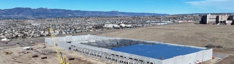 Aerial view of the American Furniture Warehouse commercial roofing project in Colorado Springs, CO — 350,000 sq ft TPO roof by Tectum Roofing